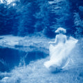 Graceful figure dancing under moonlight by Millie Franz, archival photographic print, available at Ilkaa's Fine Art Gallery.