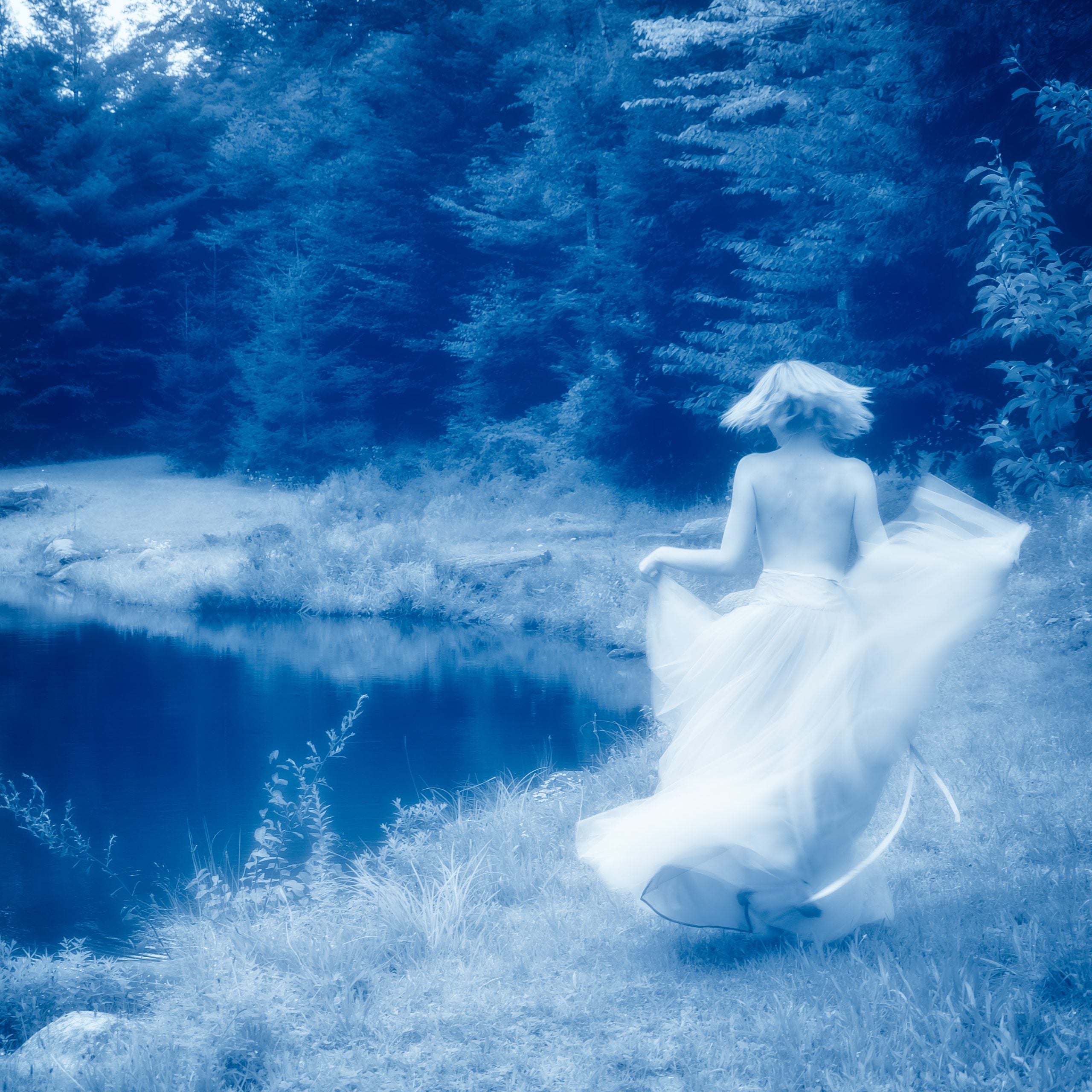 Graceful figure dancing under moonlight by Millie Franz, archival photographic print, available at Ilkaa's Fine Art Gallery.